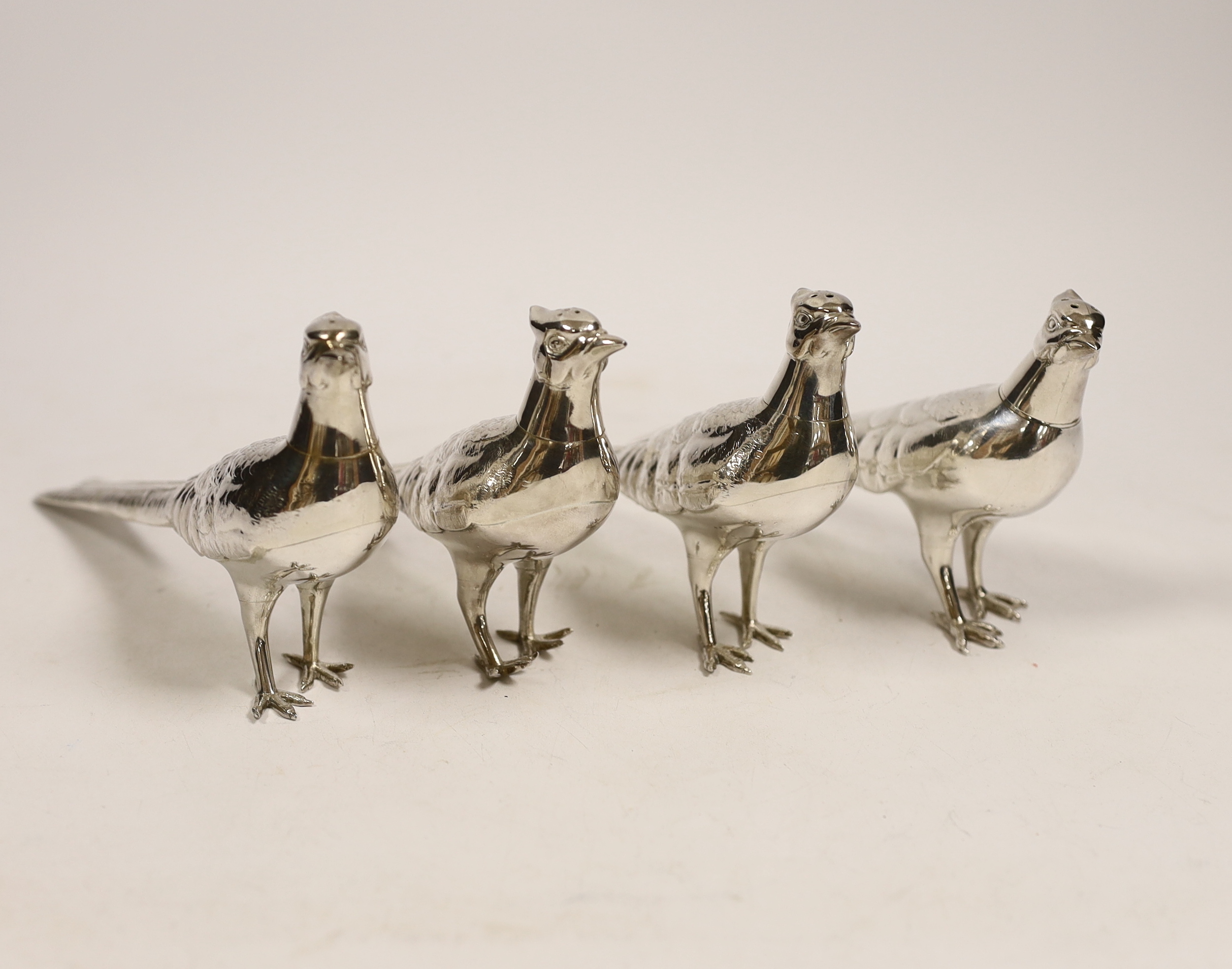 A set of four Japanese sterling condiments, by Kichigoro Uyeda, modelled as game birds, height 93mm, 16oz.